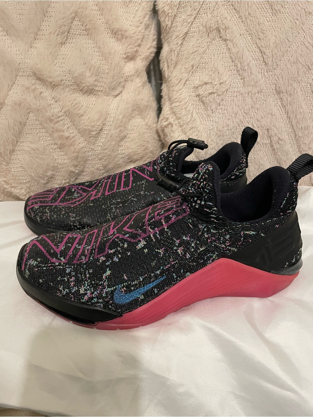 Nike Black Knit Slip-On Athletic Shoes with Pink Midsole and Blue Swoosh